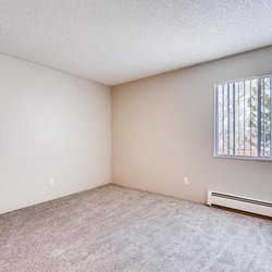 Carpeted bedroom with ample outlets at The Oslo, located in Northglenn, CO