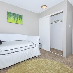 Secondary carpeted bedroom with large closet at The Oslo, located in Northglenn, CO