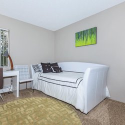 Secondary carpeted bedroomwith desk and daybed  at The Oslo, located in Northglenn, CO
